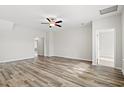 Spacious bedroom with stylish ceiling fan and durable hardwood flooring at 3332 Little Bay Dr., Conway, SC 29526