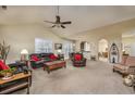 Expansive living room featuring comfortable seating, neutral carpet, and seamless flow into adjacent dining area at 3507 Club Course Dr., North Myrtle Beach, SC 29582