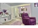 Living room with light purple walls, modern fixtures, and a clear view of the dining area at 415 28Th Ave. N # 4-A, Myrtle Beach, SC 29577