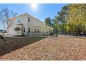 The backyard offers a fenced in pool area, screened-in porch, and ample space for outdoor activities and relaxation at 425 Retriever Ct., Murrells Inlet, SC 29576