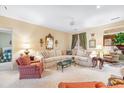 Bright living room with plush seating and a view into an adjacent room with bay windows at 4413 Bed Straw Ct., Murrells Inlet, SC 29576