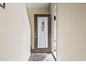 Inviting entryway with decorative rug and open doorway showcasing condo's interior at 4502 Little River Inn Ln. # 2507, Little River, SC 29566