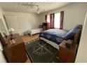 Cozy bedroom with nautical themed decor, featuring a full and a twin bed with wood flooring at 4601 Lewis St., North Myrtle Beach, SC 29582