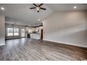 Spacious living room flows into the kitchen, featuring hardwood floors and natural light at 4975 Dupont Rd., Conway, SC 29526