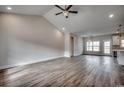 Bright open-concept living room featuring hardwood floors, vaulted ceilings, and natural light at 4975 Dupont Rd., Conway, SC 29526