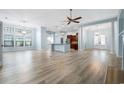 Spacious living room featuring hardwood floors, elegant lighting, and an open floor plan at 5230 Piemonte Ln., Myrtle Beach, SC 29579