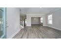 Bright and airy living room boasts beautiful gray floors and ample natural light at 546 Haven View Way, Murrells Inlet, SC 29576