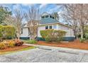 Charming home featuring manicured landscaping, parking, and a welcoming facade at 65 Lakeside Dr. # 65A, Pawleys Island, SC 29585