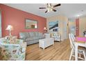 Inviting living room with hardwood floors, comfortable seating, and colorful accents at 709 Shell Creek Circle # 709, North Myrtle Beach, SC 29582