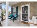 Cozy front porch with comfortable seating, creating a welcoming entrance to the home at 759 Painted Bunting Ct. # A, Murrells Inlet, SC 29576