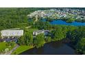 Aerial perspective of condo complex near a lake and residential area, highlighting the property's location at 922 Fairwood Lakes Ln. # 22M, Myrtle Beach, SC 29588