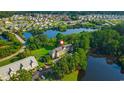 Scenic aerial view of the condo complex nestled among trees and overlooking a beautiful lake at 922 Fairwood Lakes Ln. # 22M, Myrtle Beach, SC 29588