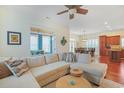 Spacious living room with hardwood floors and a large sectional sofa at 10 Orchard Ave., Murrells Inlet, SC 29576