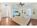 Cozy living room featuring hardwood floors and a comfortable sectional sofa at 10 Orchard Ave., Murrells Inlet, SC 29576