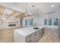 Modern kitchen featuring a large island, quartz countertops, stainless steel appliances and seamless flow to the living area at 1054 East Isle Of Palms Ave., Myrtle Beach, SC 29579