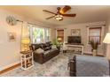 Relaxing living room with a large sofa, big window, and ceiling fan at 1105 Palmetto St., Georgetown, SC 29440