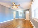 Spacious living room with hardwood floors, a ceiling fan, and neutral-colored walls at 1105 Scott Dr., Myrtle Beach, SC 29577