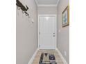 Entryway featuring a white door, a nautical-themed rug, and a coat rack with hooks at 131 Waypoint Ridge Ave. # Q-14, Little River, SC 29566