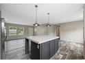 Modern kitchen featuring a center island, stainless steel appliances, and open layout at 1310 Rabbit Ln., Conway, SC 29526