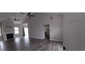 Bright living room with sleek gray flooring, white fireplace, and neutral gray paint at 134 Clovis Circle, Myrtle Beach, SC 29579