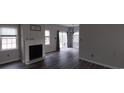 Bright living room featuring sleek gray flooring, white fireplace, and natural light at 134 Clovis Circle, Myrtle Beach, SC 29579