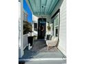 Inviting front porch featuring stylish decor, modern lighting, and comfortable seating, perfect for relaxing outdoors at 1391 Peterson St., Myrtle Beach, SC 29577