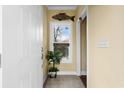 Welcoming foyer area featuring a charming window and stylish tile flooring at 202 Cypress Knee Ct., Conway, SC 29526