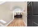 Inviting entryway with an arched doorway, light-colored walls, and wood-look flooring that leads into the living space at 233 Carolina Farms Blvd., Myrtle Beach, SC 29579