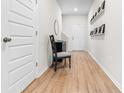 Bright foyer featuring wood floors, a charming chair, and decorative accents at 242 Timber Oaks Dr., Myrtle Beach, SC 29588