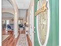 Bright foyer featuring hardwood floors and an open view into the living and dining areas at 256 Maple Oak Dr., Conway, SC 29526