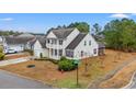 Aerial view of a two-story home with well-maintained landscaping, a two car garage, and beautiful surroundings at 3000 Chesterwood Ct., Myrtle Beach, SC 29579