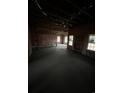 Spacious new construction living room featuring stud framing, pink insulation, and natural light at 3424 Asbury Rd., Aynor, SC 29511