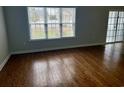 Open living room featuring hardwood floors and a sliding glass door at 422 Cassian Way, Myrtle Beach, SC 29588