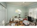 Bedroom with a ceiling fan, light green walls, and boxes of personal items on the floor at 4220 Coquina Harbour Dr. # B-12, Little River, SC 29566