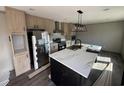 New kitchen featuring an island with marble countertops, stainless steel appliances, and sleek modern lighting at 495 N Green Sea Rd., Loris, SC 29569