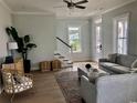 Cozy living room featuring stylish furnishings and a comfortable seating arrangement. Hardwood flooring throughout at 8156 Living Tide Dr., Myrtle Beach, SC 29572