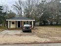 Single story home featuring a cozy porch and private driveway at 901 4Th Ave. N, Myrtle Beach, SC 29577