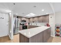 Bright kitchen featuring stainless steel appliances, stone countertops, and modern cabinetry at 9840 Queensway Blvd. # 1207, Myrtle Beach, SC 29572