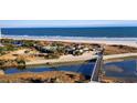 Beautiful aerial view of the beach, pool, and community at 101 Ocean Creek Dr. # Dd-9, Myrtle Beach, SC 29572