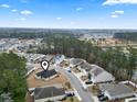 Wide aerial view of a residential neighborhood showing tree coverage and the layout of the single-Gathering home at 1222 Midtown Village Dr., Conway, SC 29526