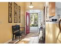 Inviting foyer with tile flooring, decorative accents, and a view to the outdoors at 1822 Topsail Ln., North Myrtle Beach, SC 29582