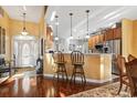 Open-concept kitchen with stainless steel appliances and adjacent breakfast bar and nook at 1822 Topsail Ln., North Myrtle Beach, SC 29582