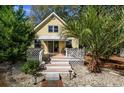 Inviting front porch featuring white lattice trim, quaint details, and a comfortable outdoor space at 2120 Adams Way, Little River, SC 29566