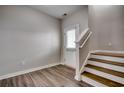 Entryway with beautiful vinyl flooring, stairway to the upper floor, and bright white trim at 223 Gloucester Way, Little River, SC 29566