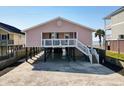 Lovely raised beach home with covered parking and peek of the ocean at 2402 N Ocean Blvd., North Myrtle Beach, SC 29582