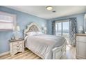 Serene main bedroom with ocean view and access to balcony at 2402 N Ocean Blvd., North Myrtle Beach, SC 29582