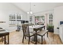 Bright dining area with wood floors, table with chairs and bench seating, and natural light at 281 Encore Circle, Myrtle Beach, SC 29579