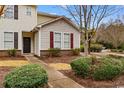 Inviting exterior of a well-maintained townhome showcasing manicured landscaping and a welcoming entrance at 306 Kiskadee Loop # 4-F, Conway, SC 29526