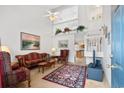 Bright and airy living room with vaulted ceilings and staircase access, with blue front door at 3567 Chestnut Dr. # 3567, Myrtle Beach, SC 29577