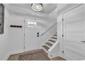 Bright entryway features wood floors, white trim, and a staircase to the upper level at 39 Lazy Hammock Trail, Pawleys Island, SC 29585